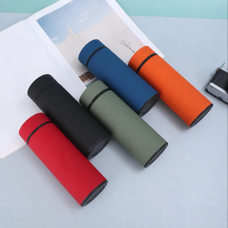 Slim travel bottles in red, black, green, blue and orange