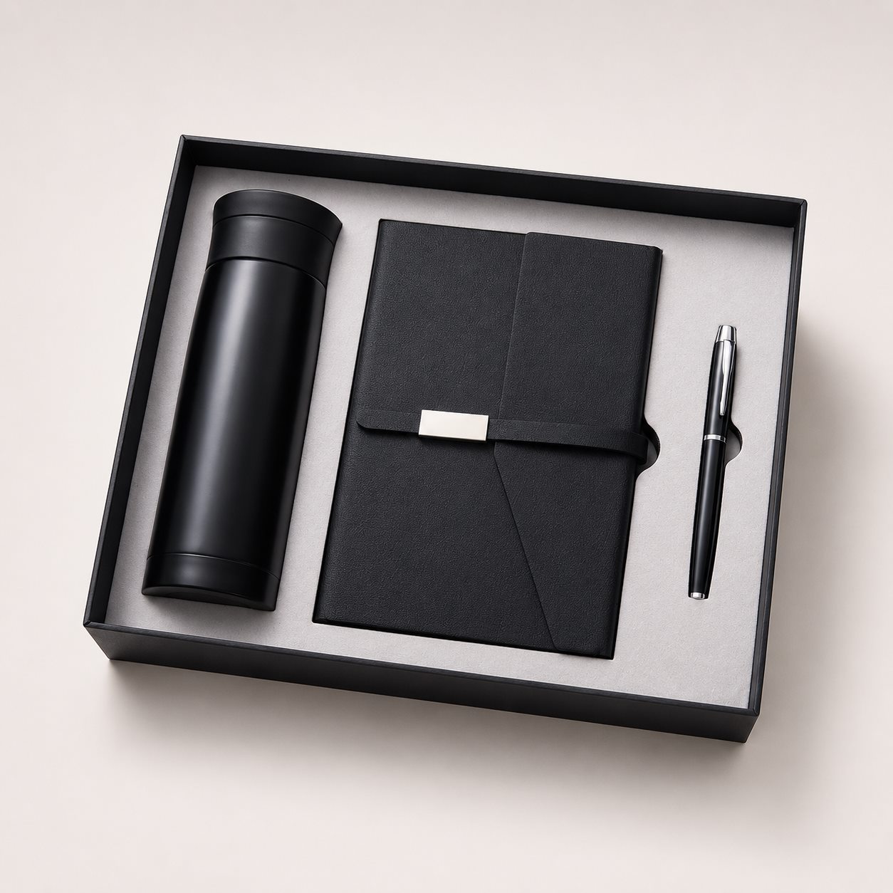 Black executive gift set with bottle notebook and pen