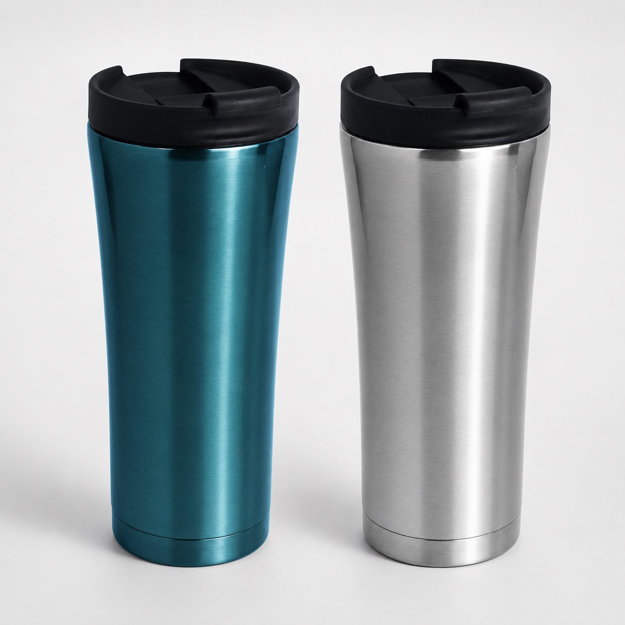 Stainless steel travel tumbler in blue and silver