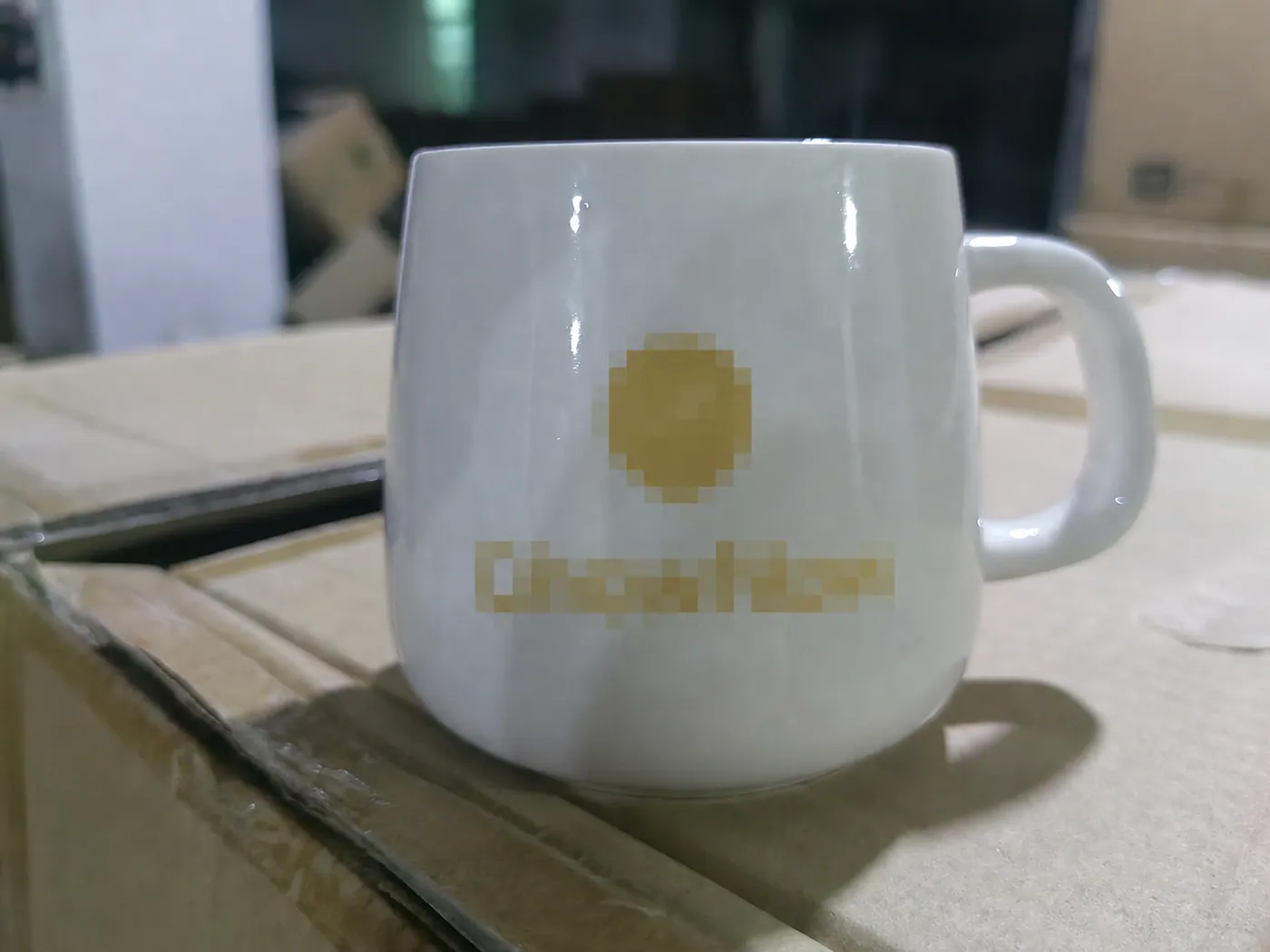 Anonymized ceramic mug logo print sample